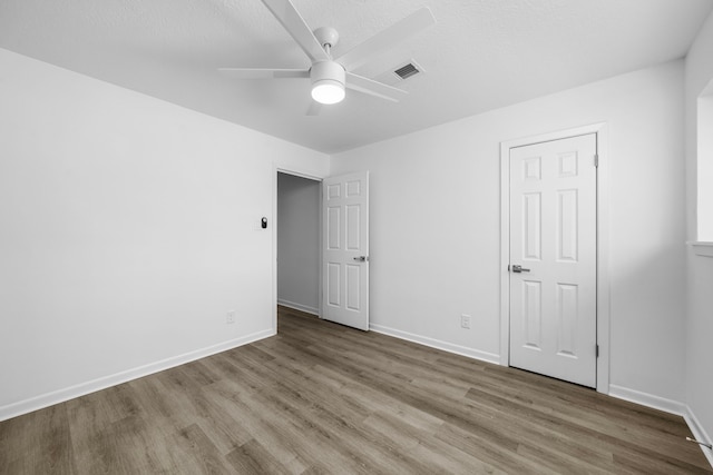 unfurnished bedroom featuring ceiling fan and wood-type flooring