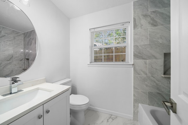 full bathroom with tiled shower / bath, vanity, and toilet