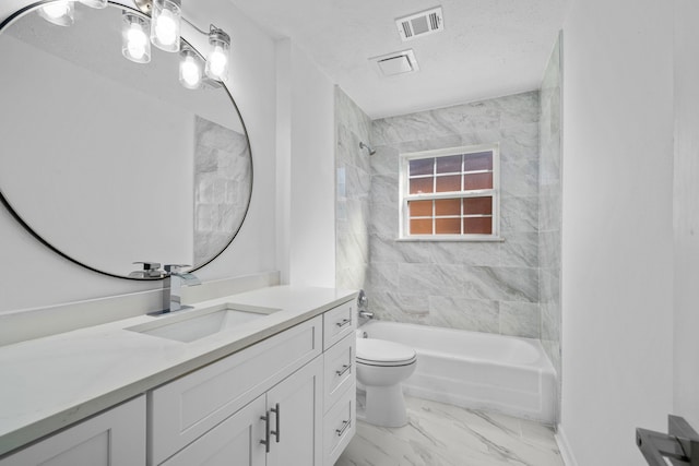 full bathroom featuring vanity, toilet, tiled shower / bath combo, and a textured ceiling