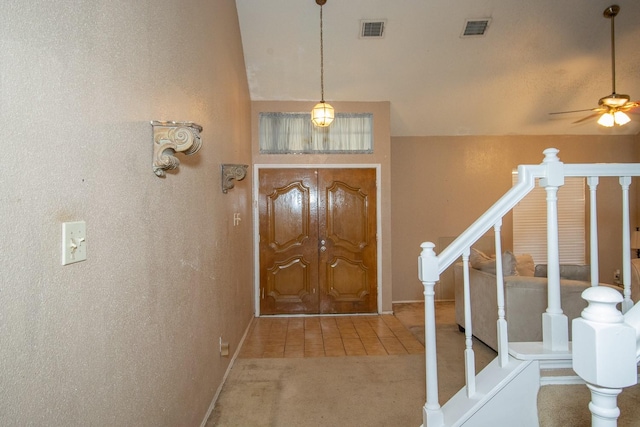 entryway featuring carpet and ceiling fan