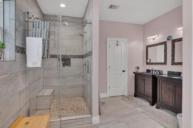 bathroom featuring vanity and an enclosed shower