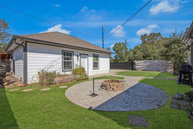 back of house featuring a yard and a patio