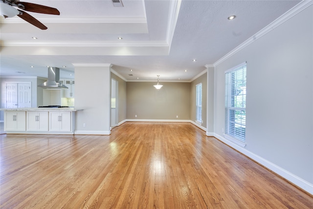 unfurnished living room with crown molding, light hardwood / wood-style flooring, and ceiling fan