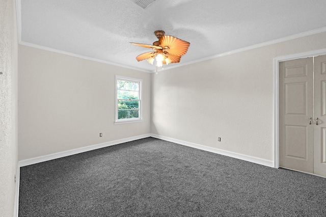 unfurnished room with a textured ceiling, carpet floors, ceiling fan, and ornamental molding