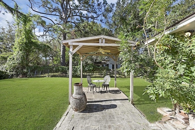 exterior space featuring a gazebo and ceiling fan