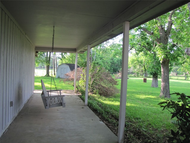 view of patio featuring a storage shed