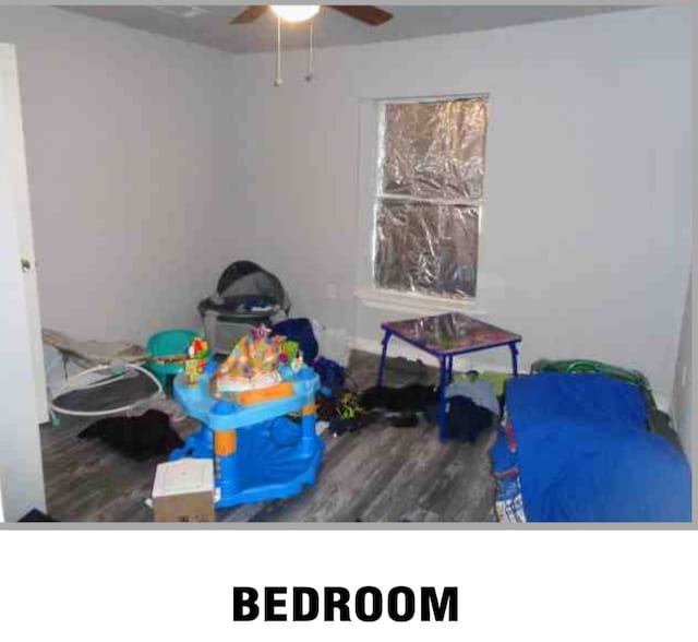 bedroom with wood-type flooring and ceiling fan