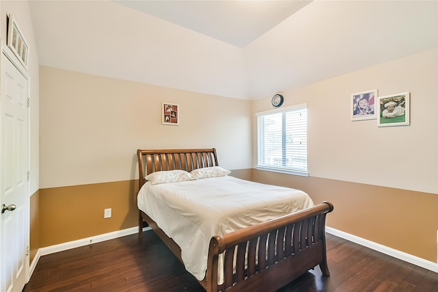 bedroom with dark wood-type flooring