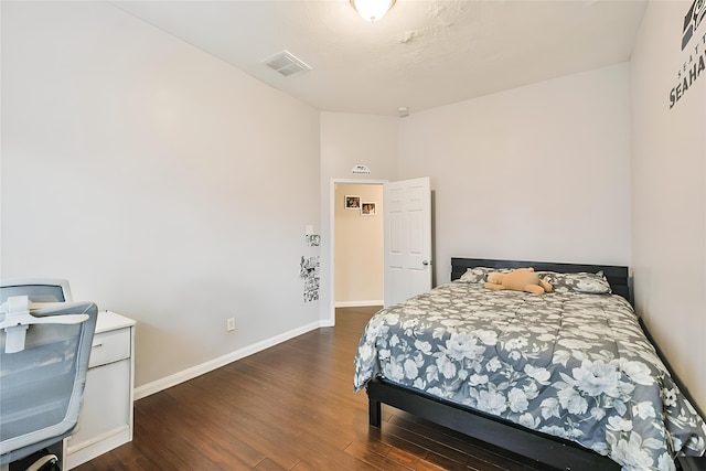 bedroom featuring dark wood-type flooring