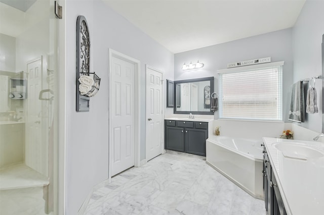 bathroom featuring a tub and vanity