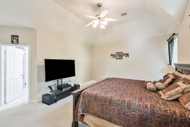 bedroom with vaulted ceiling, light colored carpet, and ceiling fan