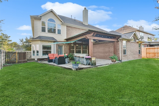 rear view of property with an outdoor hangout area, a patio, and a yard