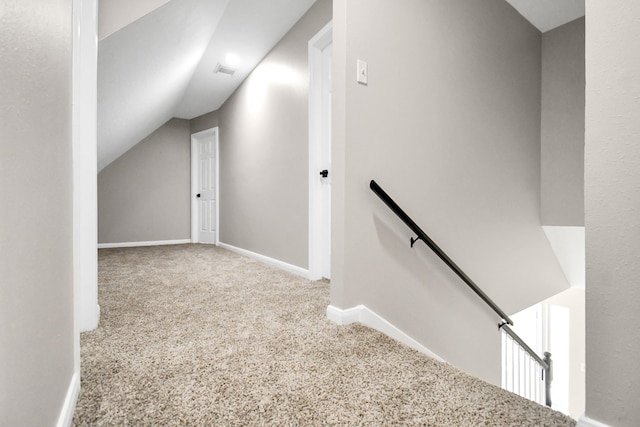 bonus room with lofted ceiling and carpet floors