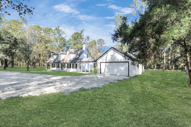 view of front of property featuring a front lawn and a garage