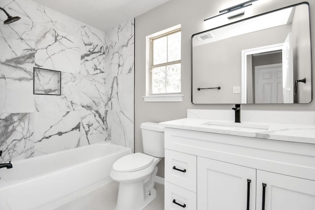 full bathroom with vanity, tiled shower / bath combo, and toilet