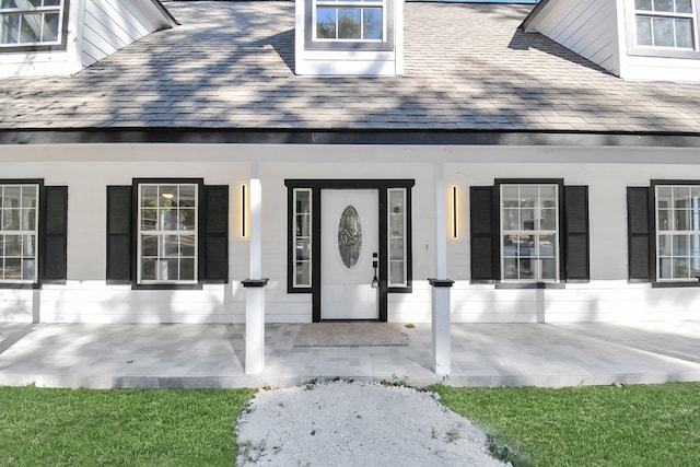 property entrance featuring covered porch