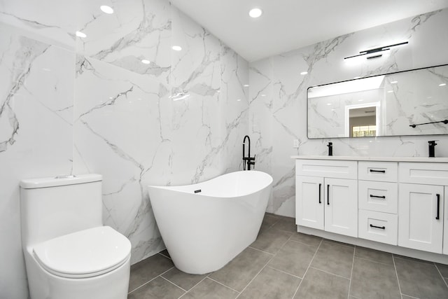 bathroom with toilet, a bathing tub, vanity, and tile walls