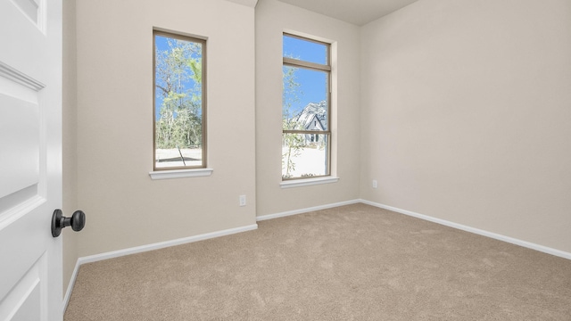 empty room with light colored carpet