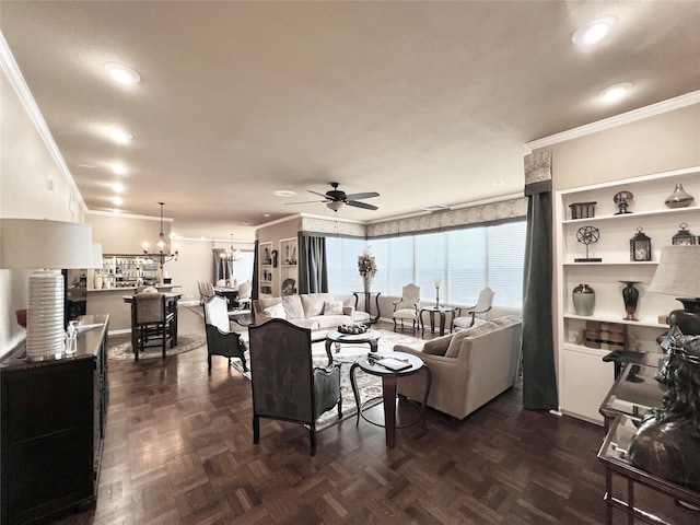 living room with ornamental molding, dark parquet flooring, and ceiling fan with notable chandelier