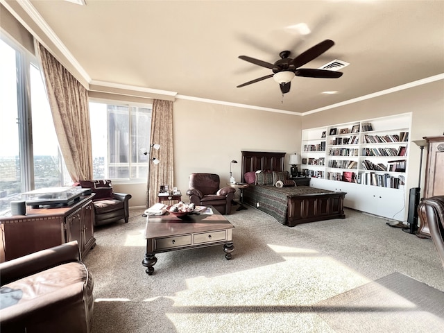 bedroom with crown molding, carpet, and ceiling fan