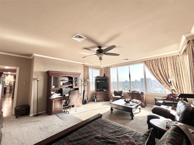 living room with crown molding, carpet flooring, and ceiling fan