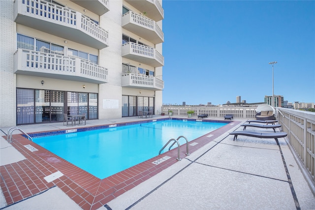 view of swimming pool with a patio area