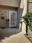 property entrance featuring a patio