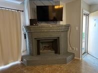 1505 Ward Rd Unit 189, Baytown, TX 77520 - living room with a fireplace with raised hearth and baseboards