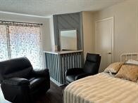 1505 Ward Rd Unit 189, Baytown, TX 77520 - bedroom featuring radiator heating unit