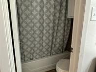 1505 Ward Rd Unit 189, Baytown, TX 77520 - bathroom featuring a shower with shower curtain and toilet