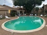 view of swimming pool featuring a patio area