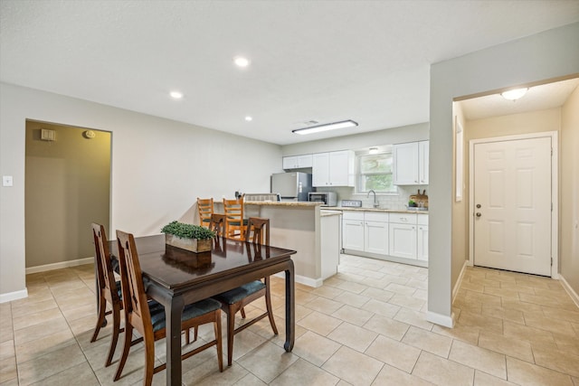 tiled dining space with sink