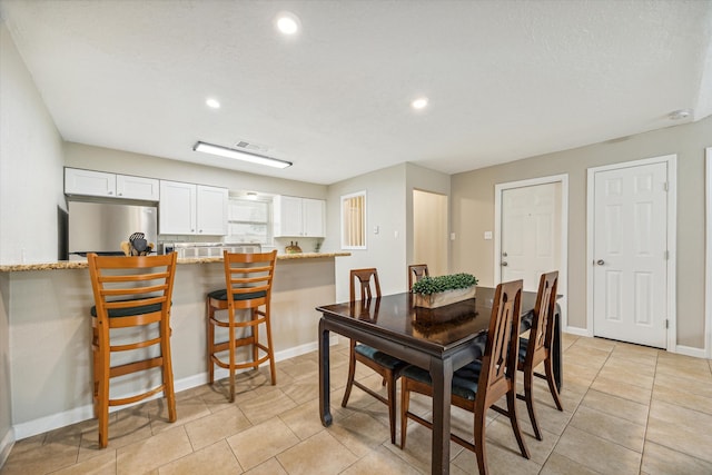 dining room featuring light tile patterned flooring