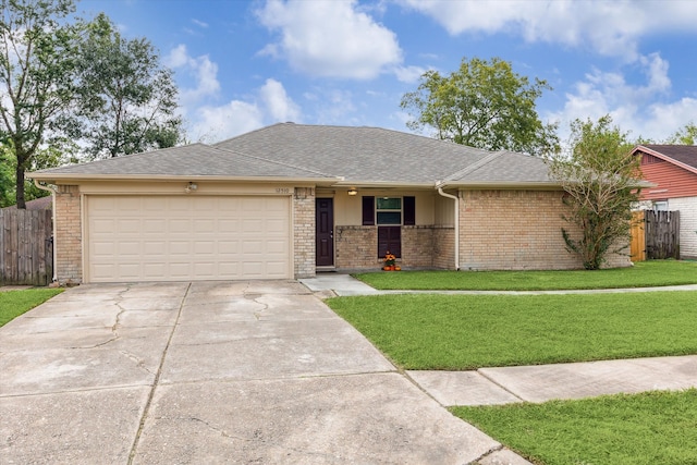 ranch-style home with a front yard and a garage