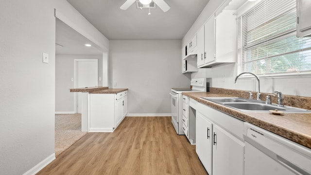 kitchen featuring white appliances, sink, white cabinetry, light hardwood / wood-style floors, and ceiling fan