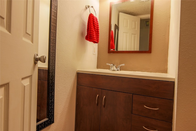 bathroom featuring vanity and a textured ceiling