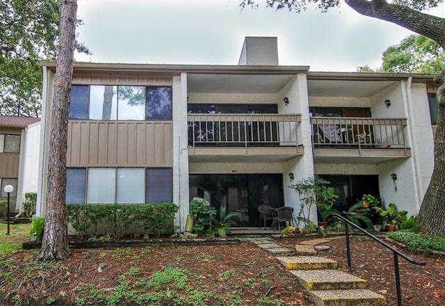 rear view of house with a balcony