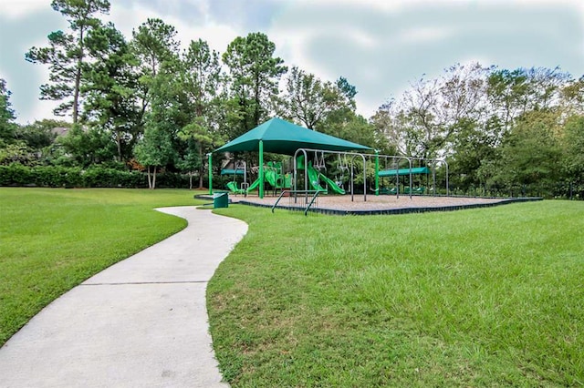 view of community featuring a yard and a playground