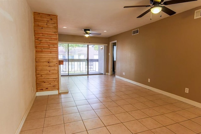 empty room featuring ceiling fan and light tile patterned flooring