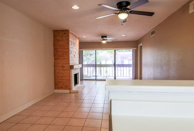 unfurnished living room featuring light tile patterned floors, a fireplace, and ceiling fan