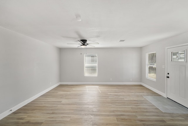 foyer featuring light wood-type flooring and ceiling fan