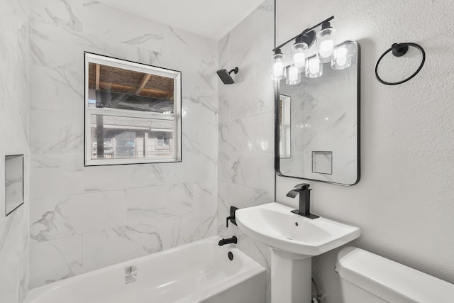 bathroom featuring toilet and tiled shower / bath combo