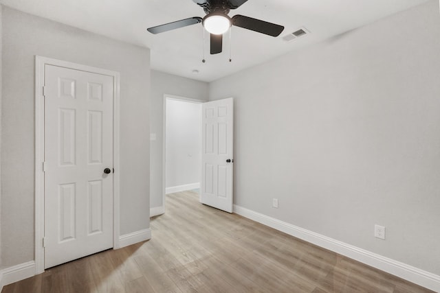 unfurnished bedroom with light wood-type flooring and ceiling fan