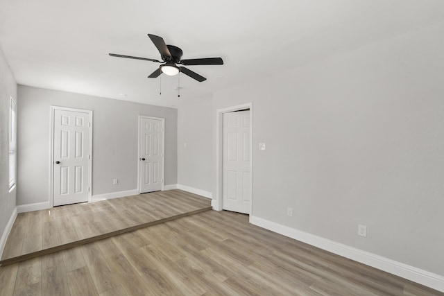 empty room featuring light hardwood / wood-style floors and ceiling fan