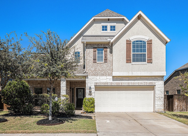 view of front of home featuring a front lawn and a garage