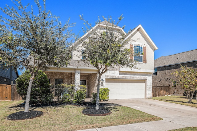 view of front of property featuring a front lawn and a garage