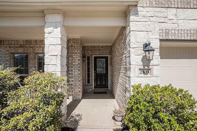 entrance to property featuring a garage