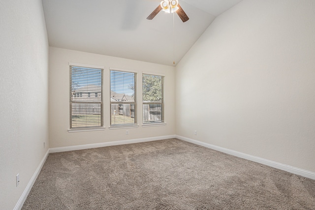 carpeted empty room with vaulted ceiling and ceiling fan