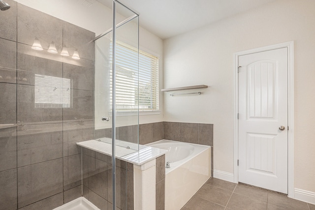 bathroom with tile patterned flooring and plus walk in shower