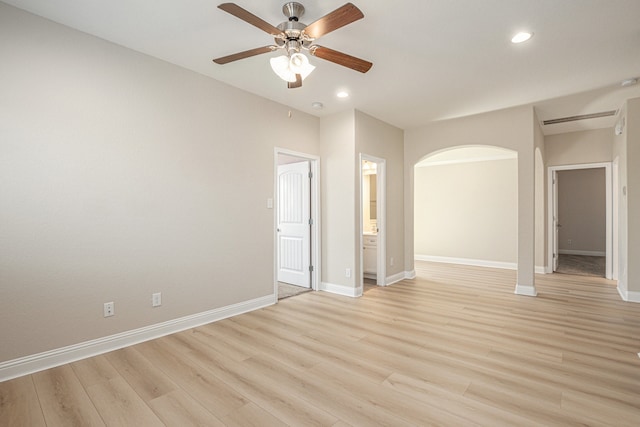 spare room with light hardwood / wood-style flooring and ceiling fan